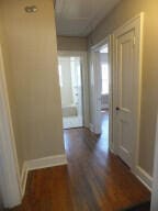 hallway with dark hardwood / wood-style floors