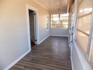 hall with dark hardwood / wood-style floors