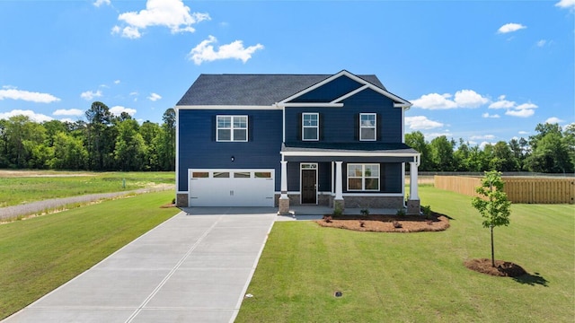 view of front of property with a front lawn, a porch, and a garage