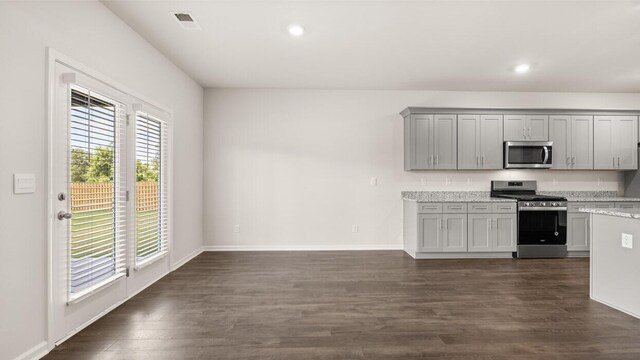 unfurnished bedroom with light colored carpet and a closet