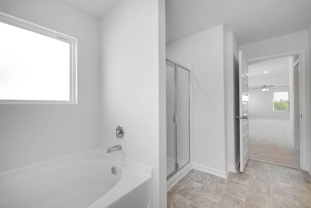 bathroom featuring separate shower and tub and ceiling fan