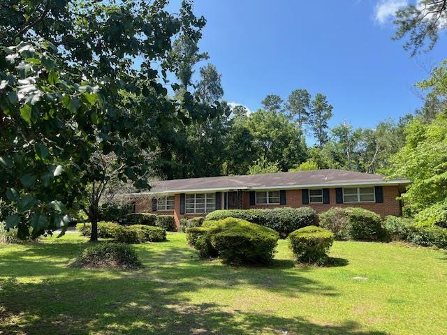 2870 Lumpkin Rd, Augusta, GA 30906 - ranch-style home with a front lawn and brick siding