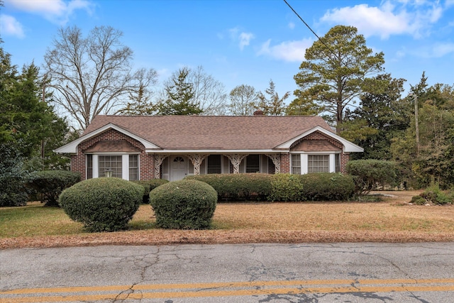 ranch-style house with a front yard