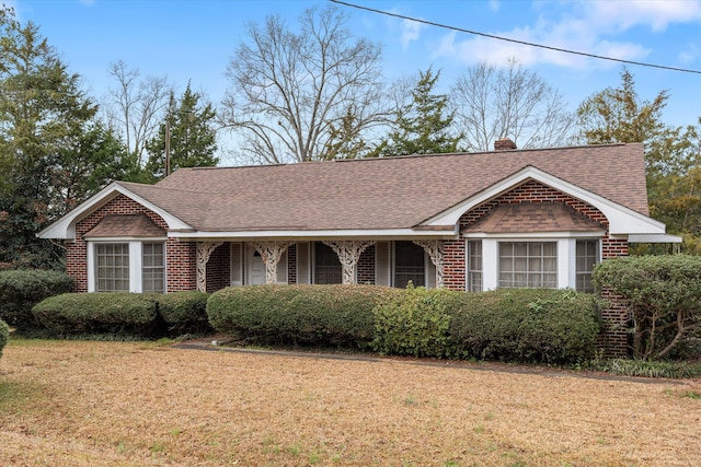 ranch-style house with a front yard