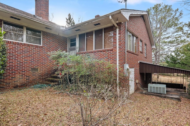 view of home's exterior with central AC unit