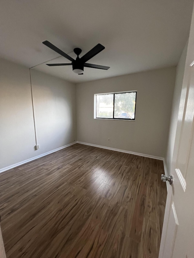 1404 Windsong Cir, Augusta, GA 30907 - spare room featuring dark wood-style floors, ceiling fan, and baseboards