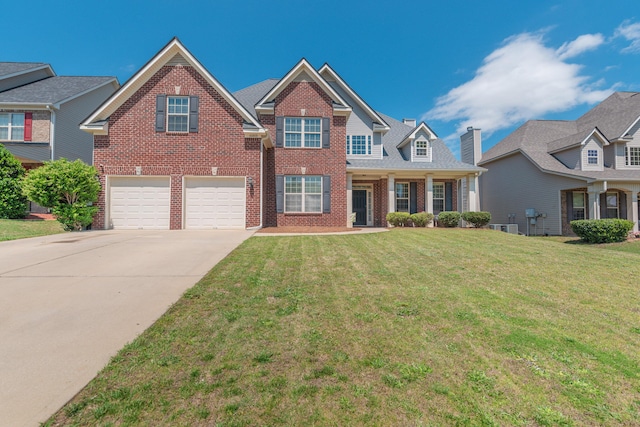 6003 Reynolds Cir, Grovetown, GA 30813 - view of front of house with brick siding, a front lawn, a garage, and driveway