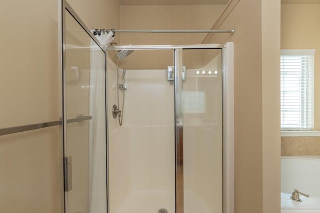 6003 Reynolds Cir, Grovetown, GA 30813 - full bath with plenty of natural light, a garden tub, and a stall shower