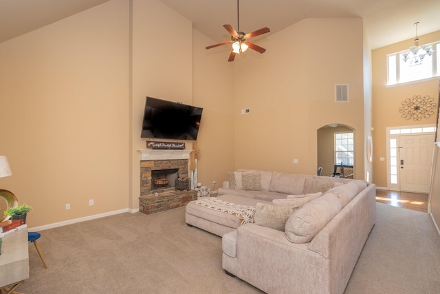 6003 Reynolds Cir, Grovetown, GA 30813 - living room with arched walkways, a ceiling fan, visible vents, a stone fireplace, and baseboards