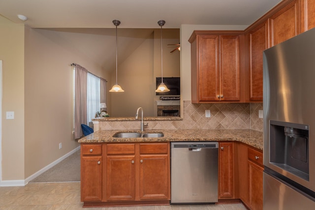 6003 Reynolds Cir, Grovetown, GA 30813 - kitchen with tasteful backsplash, appliances with stainless steel finishes, a sink, and light stone countertops