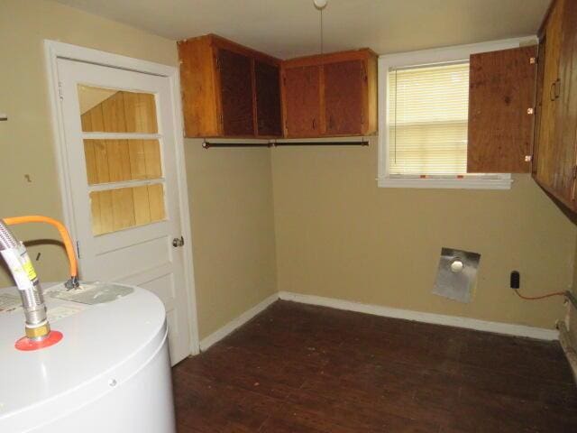 2202 Vireo Dr, North Augusta, SC 29841 - laundry room with cabinet space, dark wood finished floors, and water heater