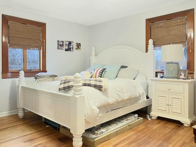 bedroom with light wood-type flooring