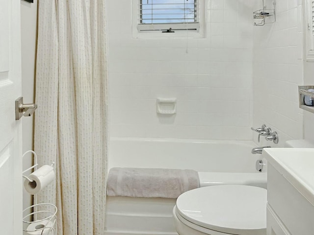 full bathroom with vanity, shower / bathtub combination with curtain, and toilet