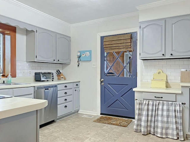 kitchen with sink, crown molding, gray cabinets, dishwasher, and backsplash