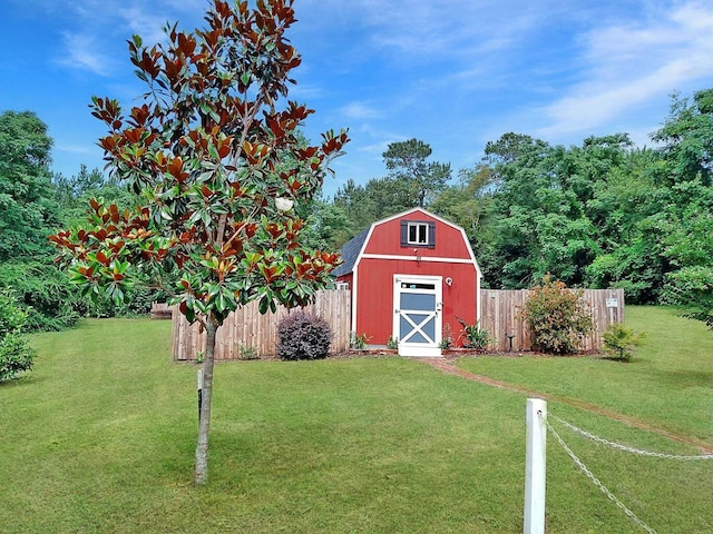 view of outbuilding with a lawn