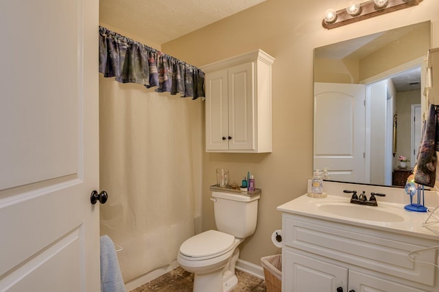 bathroom featuring baseboards, toilet, shower / tub combo with curtain, a textured ceiling, and vanity