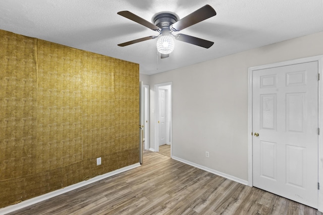 26 Charlestowne Dr, Augusta, GA 30907 - unfurnished bedroom featuring wood finished floors, baseboards, and a ceiling fan
