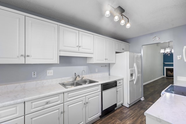 26 Charlestowne Dr, Augusta, GA 30907 - kitchen featuring dishwasher, a sink, white cabinets, white refrigerator with ice dispenser, and a textured ceiling