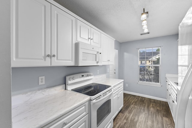26 Charlestowne Dr, Augusta, GA 30907 - kitchen featuring white appliances, white cabinetry, dark wood-style flooring, baseboards, and a textured ceiling