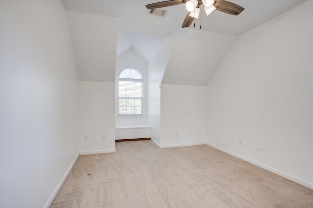 bonus room featuring ceiling fan, light colored carpet, and vaulted ceiling