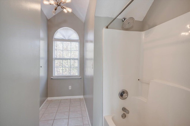 bathroom with tile patterned flooring, a chandelier, a textured ceiling, shower / bath combination, and vaulted ceiling