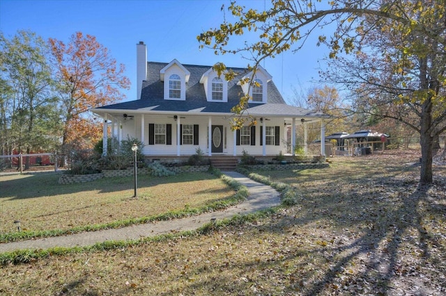 view of front facade with covered porch and a front yard