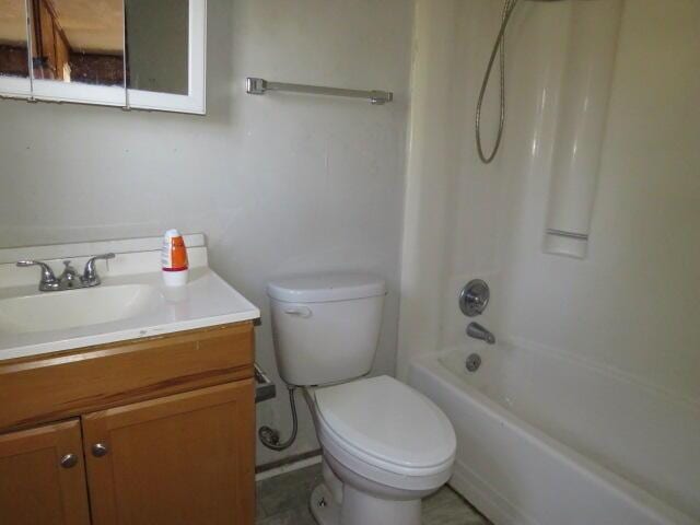 full bath featuring vanity, toilet, and bathing tub / shower combination