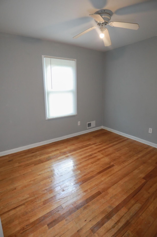 unfurnished room featuring ceiling fan and light hardwood / wood-style floors