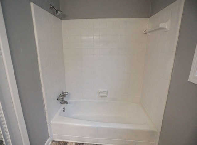 bathroom with shower / tub combination and wood-type flooring