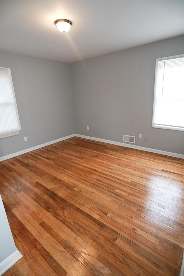 unfurnished room featuring light hardwood / wood-style flooring