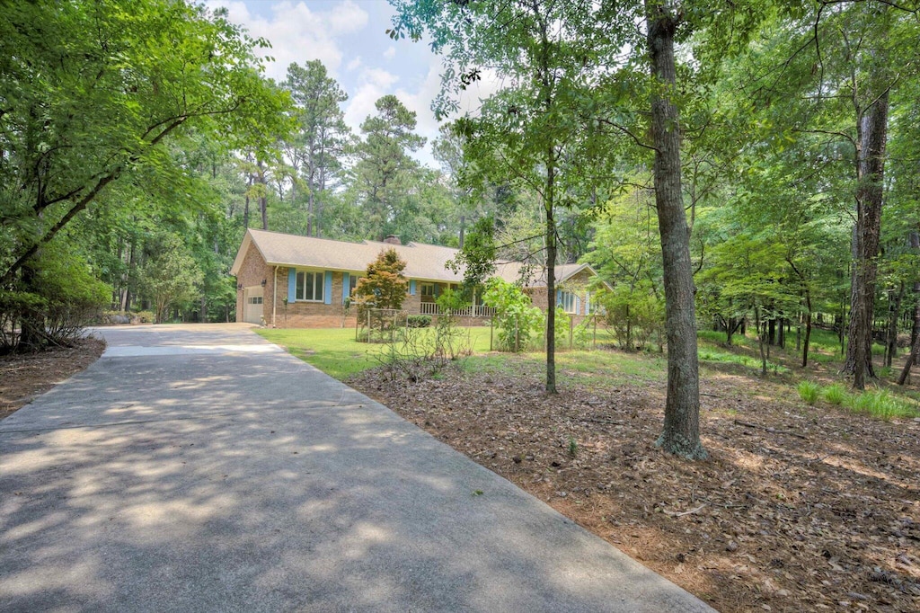 5057 Red Bud Dr, Grovetown, GA 30813 - ranch-style home featuring driveway, a chimney, and an attached garage