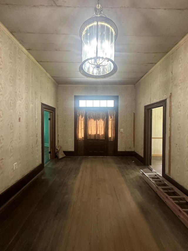 interior space with dark hardwood / wood-style floors and an inviting chandelier