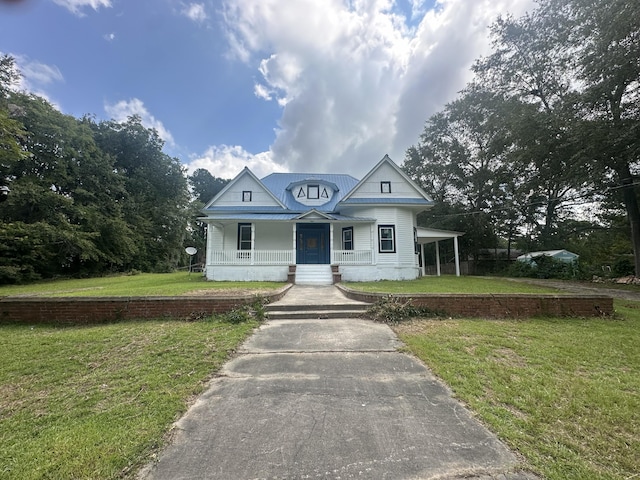 view of front of home featuring covered porch and a front yard