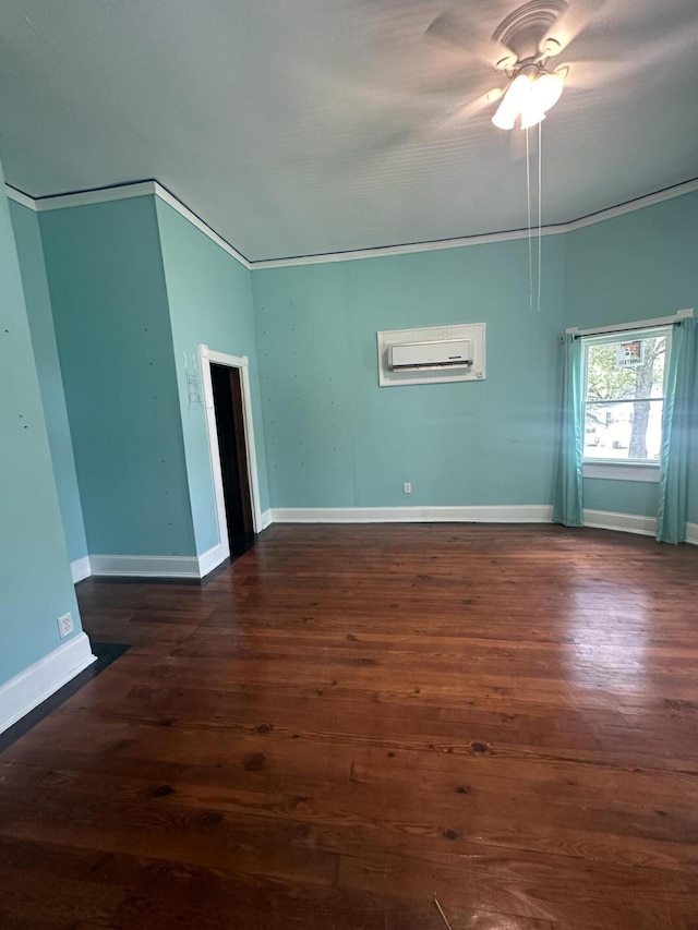 spare room featuring a wall unit AC, ceiling fan, dark hardwood / wood-style flooring, and ornamental molding