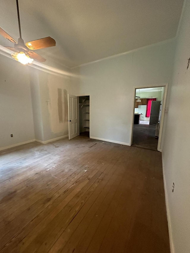 unfurnished bedroom featuring hardwood / wood-style floors and ceiling fan