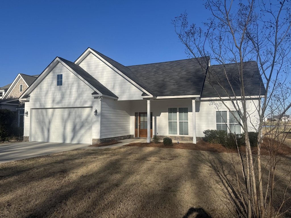 ranch-style home featuring a garage