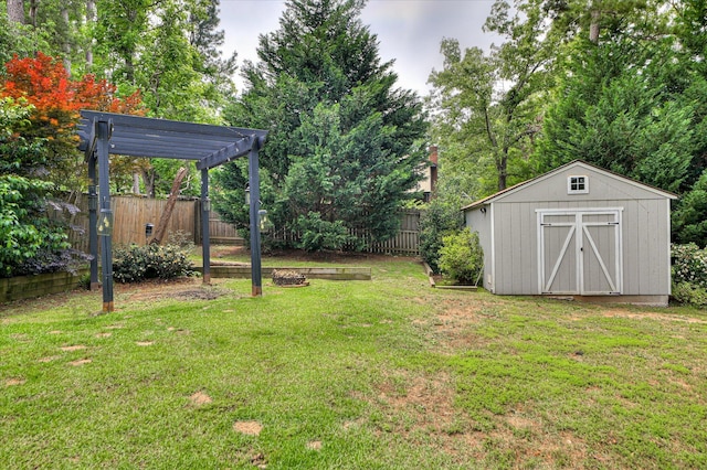 view of yard with a pergola, a storage unit, and an outdoor structure
