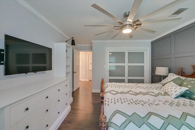 bedroom featuring crown molding, dark wood finished floors, and ceiling fan