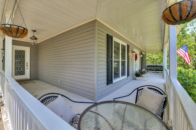 view of patio / terrace featuring covered porch and outdoor dining space