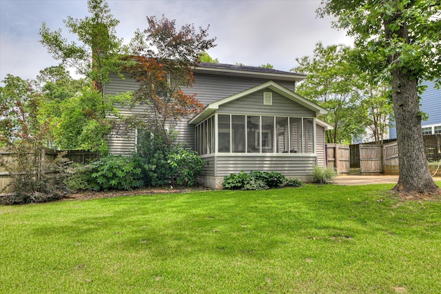 back of house with a sunroom