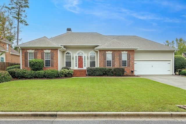 ranch-style home with a front yard and a garage