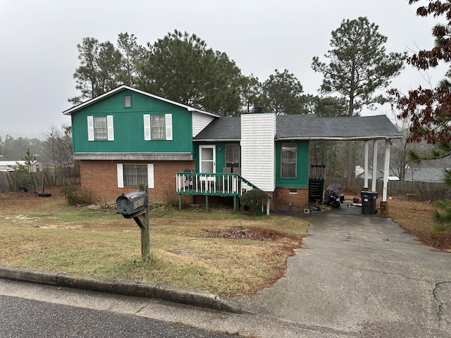 split level home featuring a front lawn