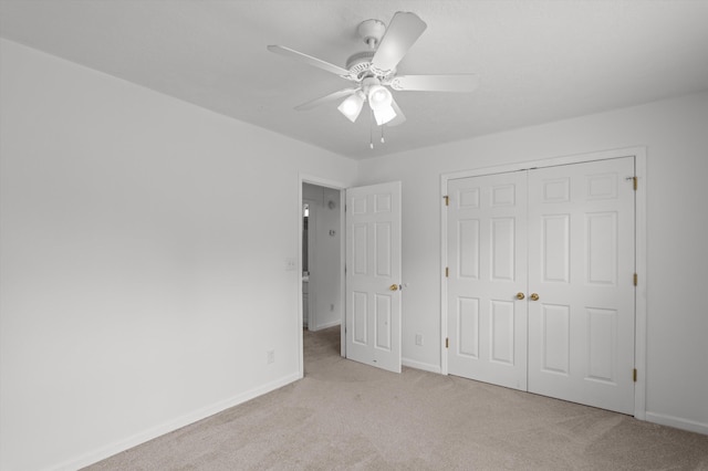 2532 Grier Cir, Evans, GA 30809 - unfurnished bedroom with carpet flooring, a closet, baseboards, and ceiling fan