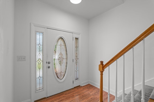 2532 Grier Cir, Evans, GA 30809 - entryway featuring stairs, wood finished floors, and baseboards