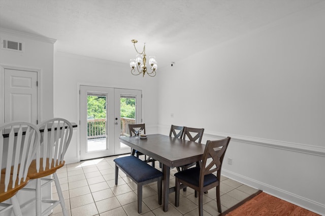 2532 Grier Cir, Evans, GA 30809 - dining room featuring french doors, a chandelier, light tile patterned flooring, crown molding, and baseboards