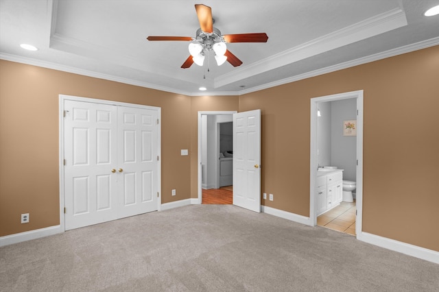 2532 Grier Cir, Evans, GA 30809 - unfurnished bedroom featuring a raised ceiling, ornamental molding, light colored carpet, recessed lighting, and ensuite bathroom