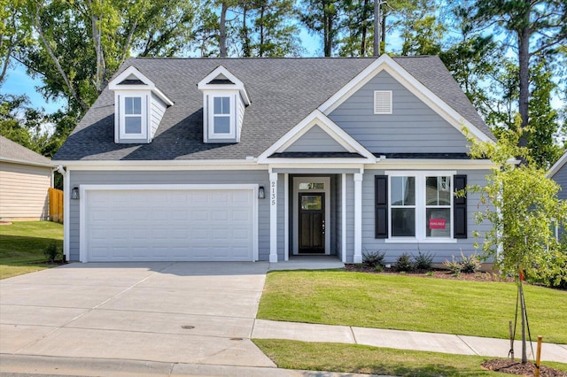 view of front facade featuring a garage and a front lawn