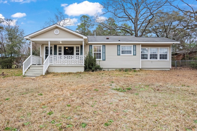 ranch-style home with a porch and a front yard