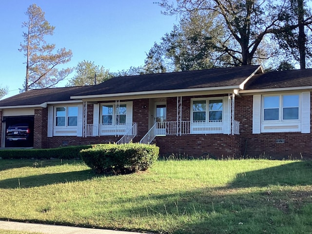 ranch-style home with a front lawn and a porch