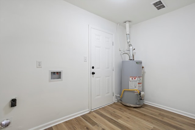 utilities featuring gas water heater and visible vents